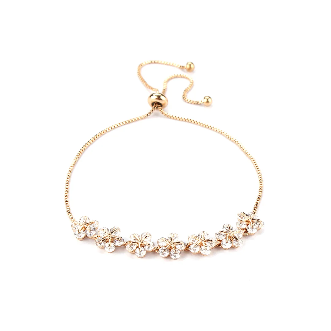 Goldfarbenes Armband mit floralen Gruppen